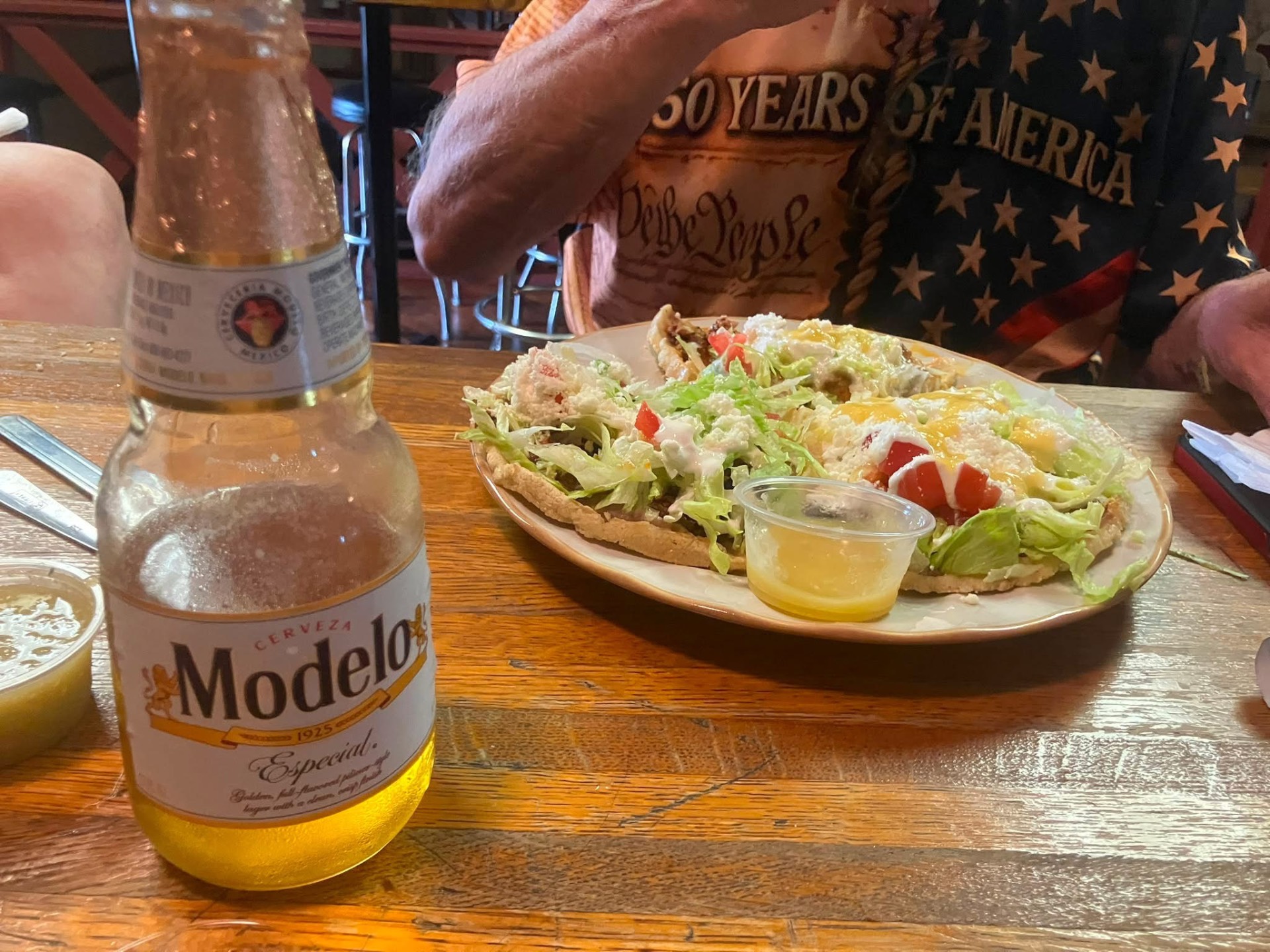 Huarache with a Modelo at the bar